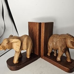 A pair of wooden hand carved elephant‎ bookends